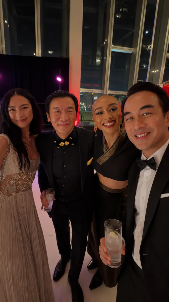 Joe Taslim in Laxmi Tailors tuxedo with guests at Gold Gala 2026 Founders Party