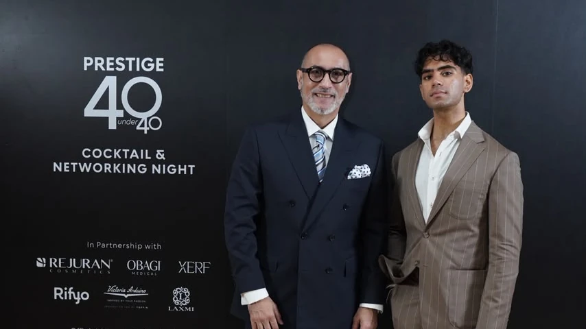 Dalip Shahri of Laxmi Tailors in a navy double-breasted bespoke suit with a guest at the Prestige Indonesia 40 Under 40 Cocktail & Networking Night, 25hours Hotel Jakarta